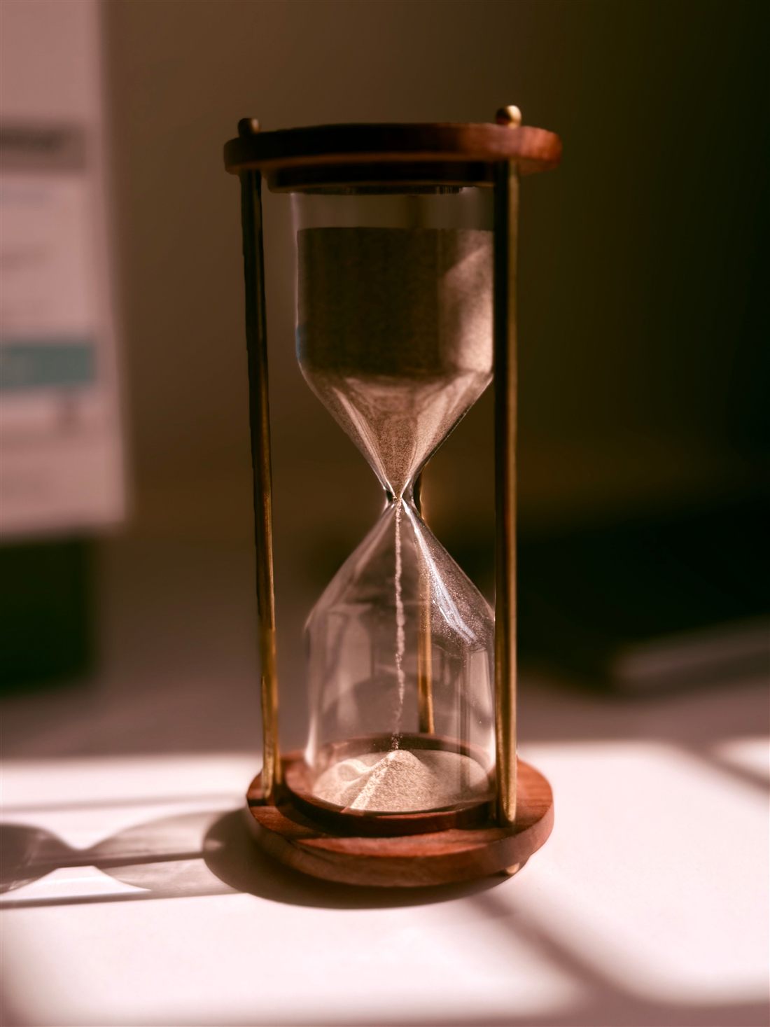 An hourglass with sand running through it, representing the Roth conversion gap years between retirement and RMDs