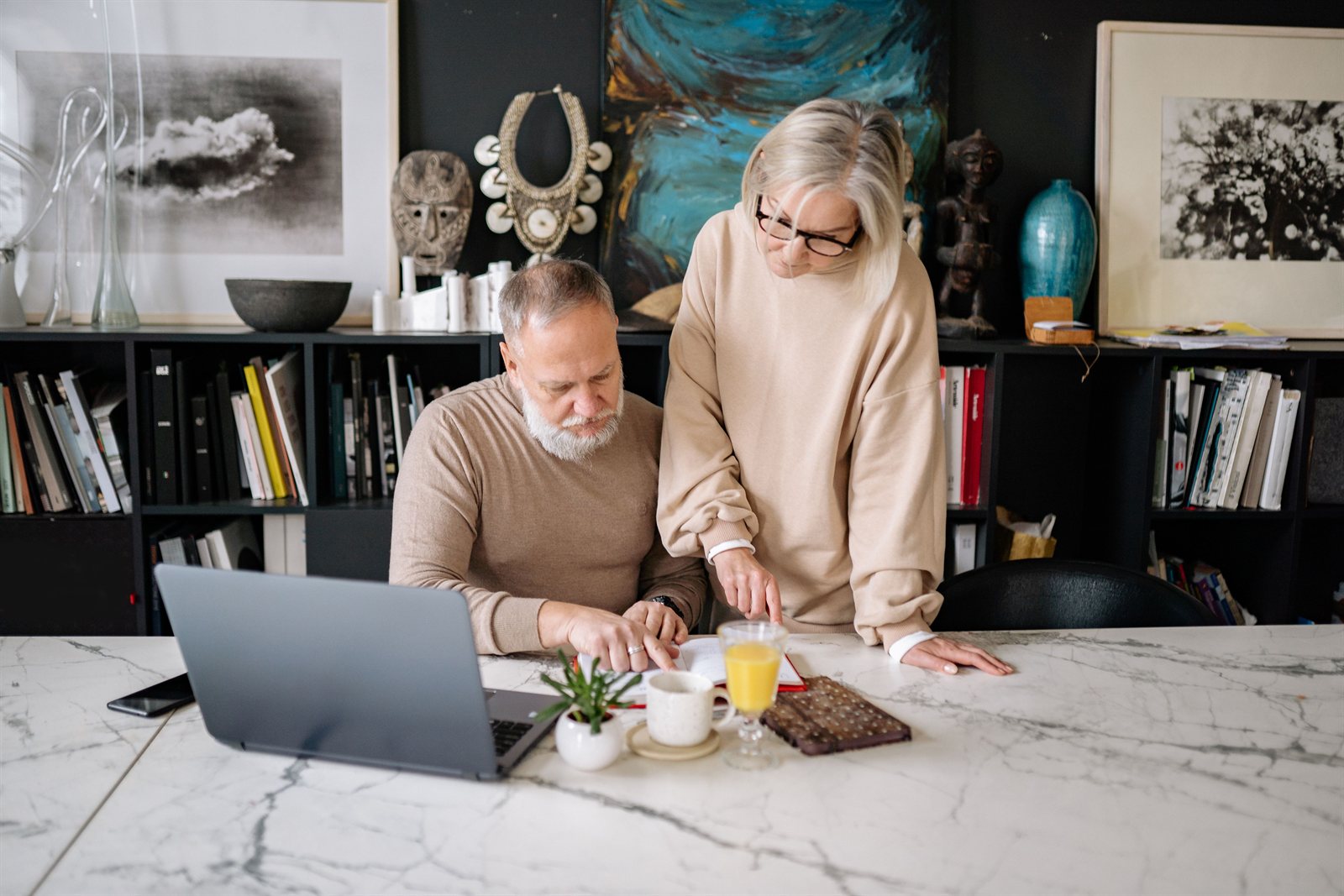 Senior couple reviewing their financial plan together at home